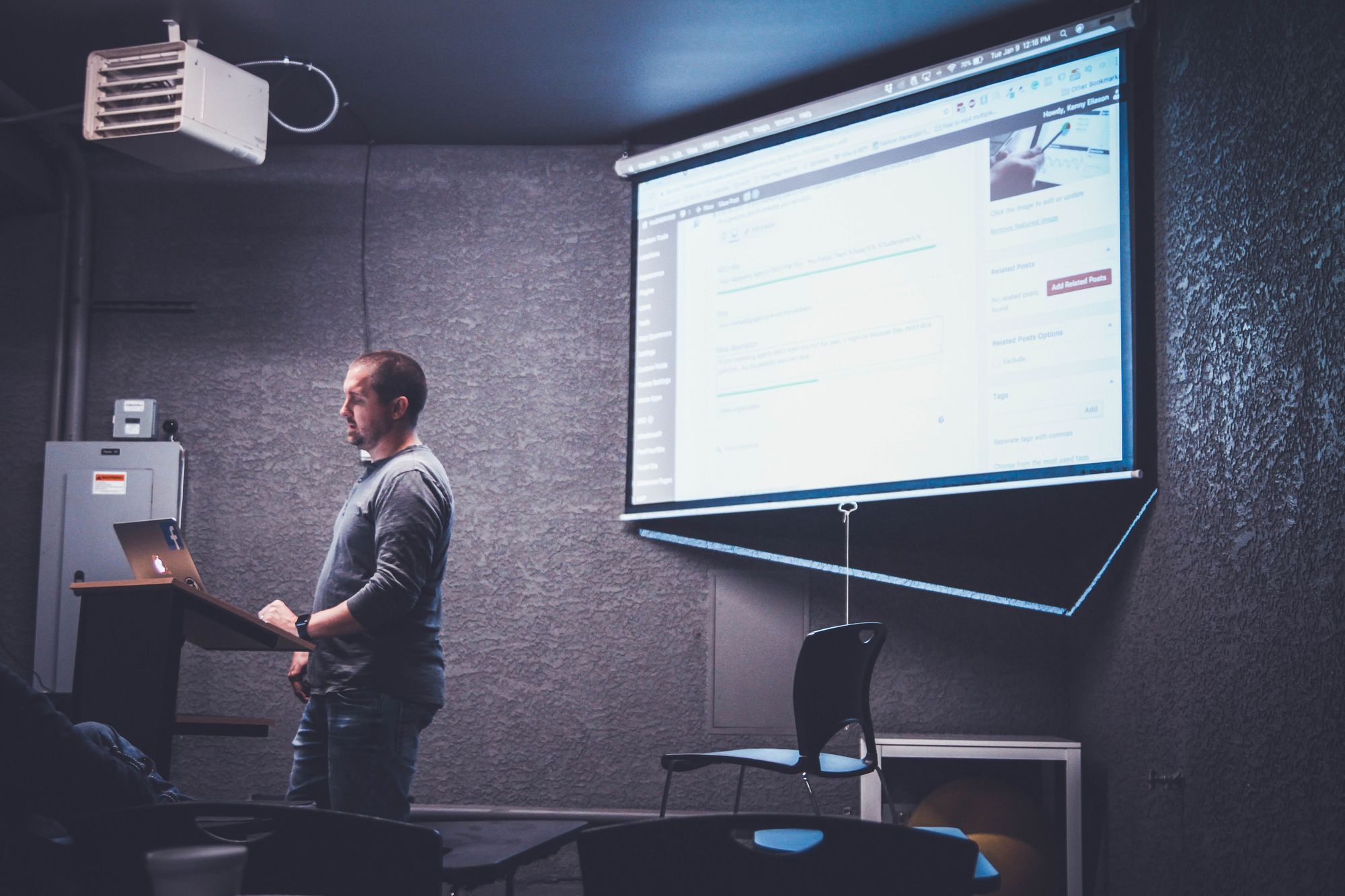 image of a man giving a presentation.