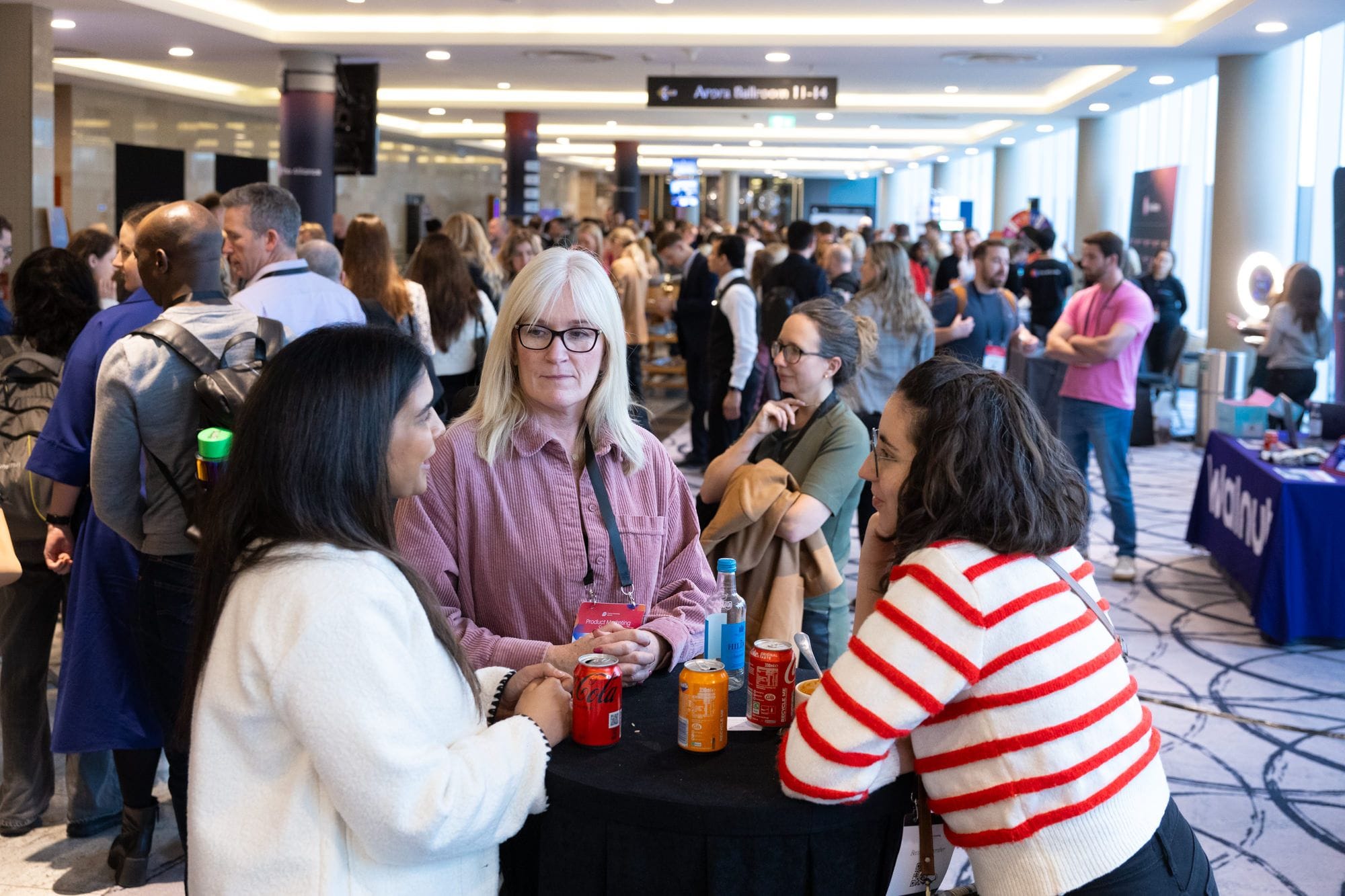 Product Marketing Alliance Summit attendees having a deep chat. 