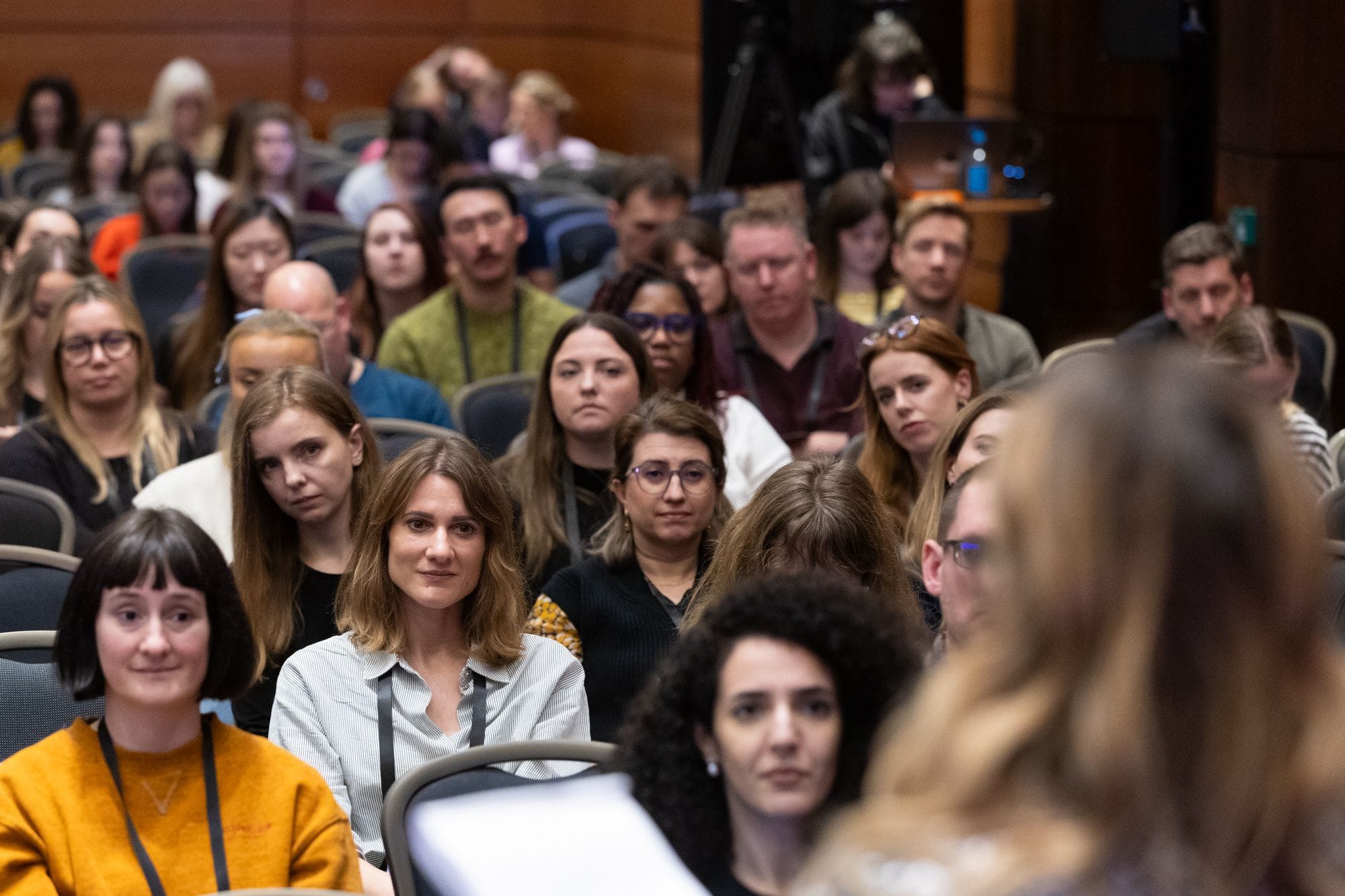 Audience sat listening captivated at the Product Marketing Summit.